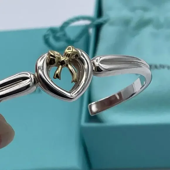 Tiffany & Co Sterling Silver and 18K Yellow Gold Heart Bow Ribbon Cuff Bracelet